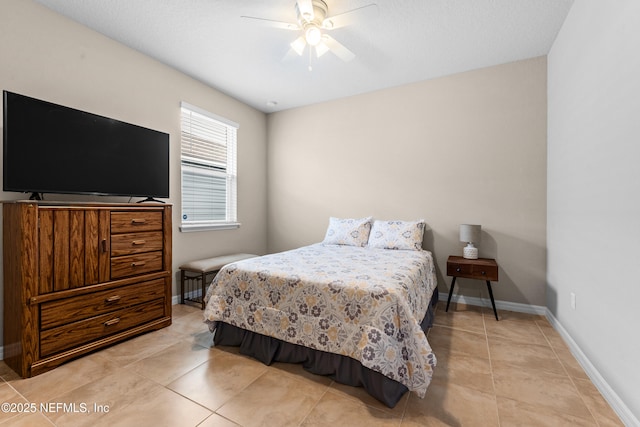 bedroom featuring light tile patterned flooring and ceiling fan