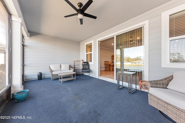 sunroom with ceiling fan