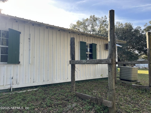 view of side of property with cooling unit