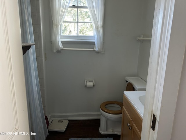 bathroom with vanity, toilet, and walk in shower