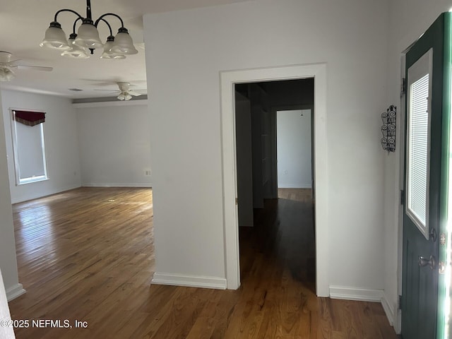 interior space featuring dark hardwood / wood-style flooring and a notable chandelier