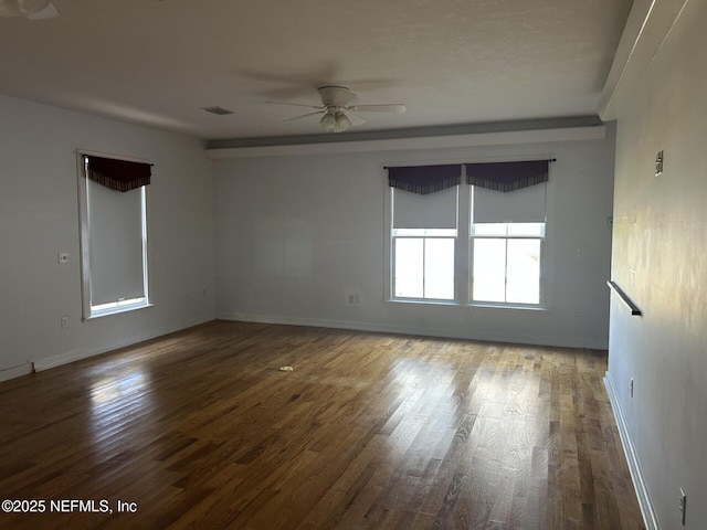 spare room with wood-type flooring and ceiling fan