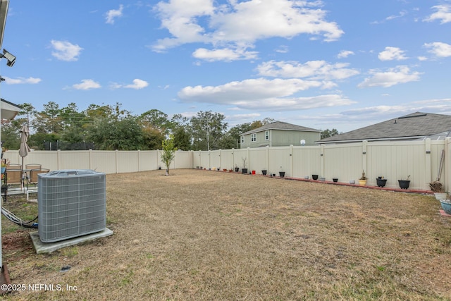 view of yard with central air condition unit