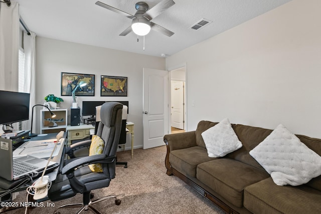 office with carpet floors and ceiling fan