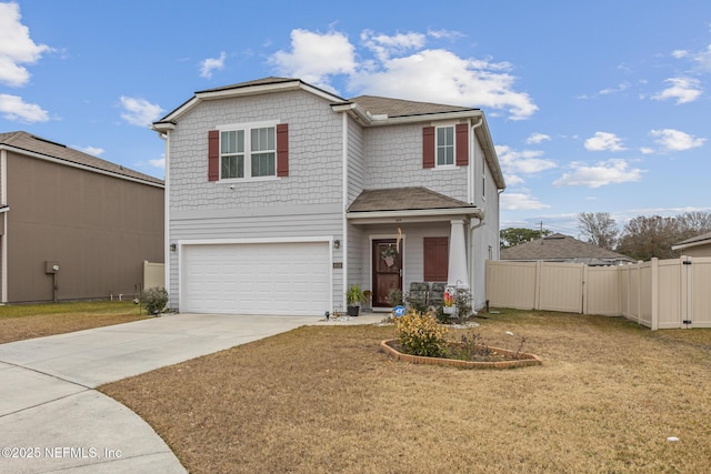 front of property featuring a garage and a front yard