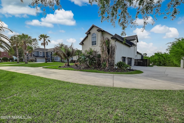 view of side of home featuring a garage and a lawn