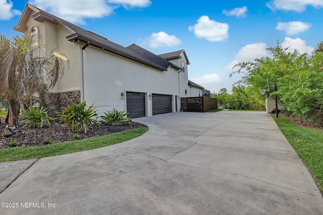 view of property exterior with a garage