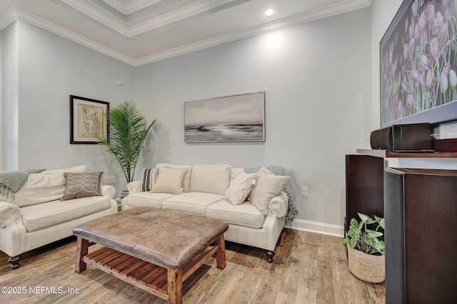 living room featuring crown molding and light wood-type flooring