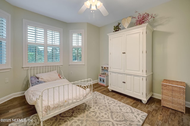 bedroom featuring dark wood-type flooring and ceiling fan