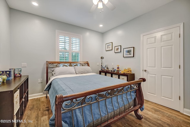 bedroom with hardwood / wood-style floors and ceiling fan