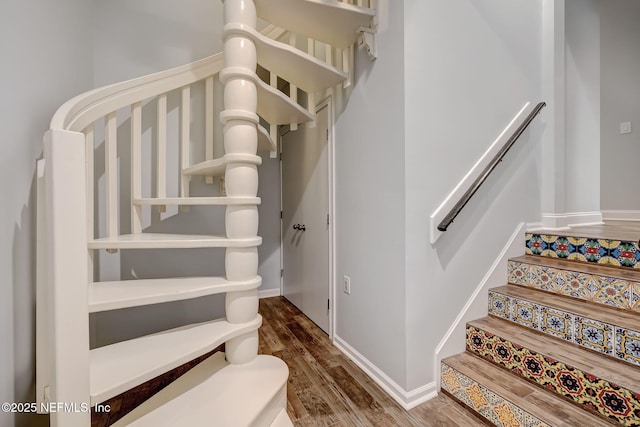 stairs with hardwood / wood-style flooring