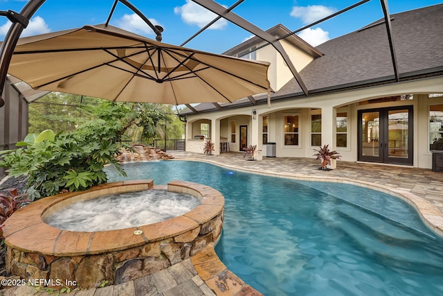 view of pool with a patio area, french doors, glass enclosure, and an in ground hot tub