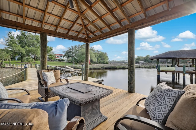 view of dock featuring a gazebo and a water view