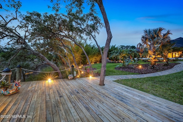 deck at dusk with a yard