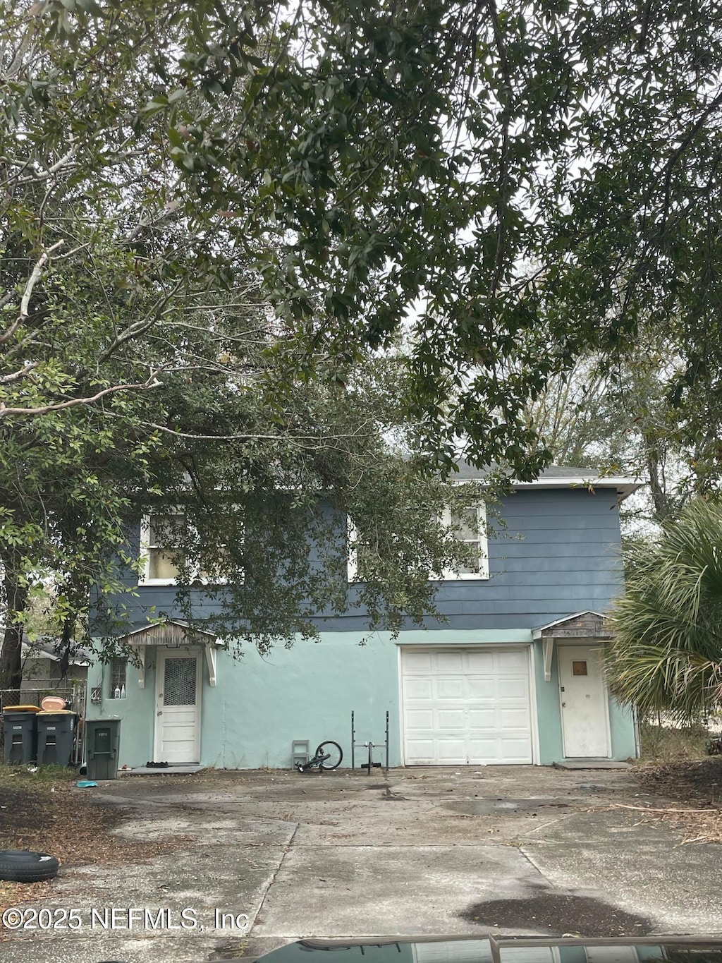 view of front of property with a garage