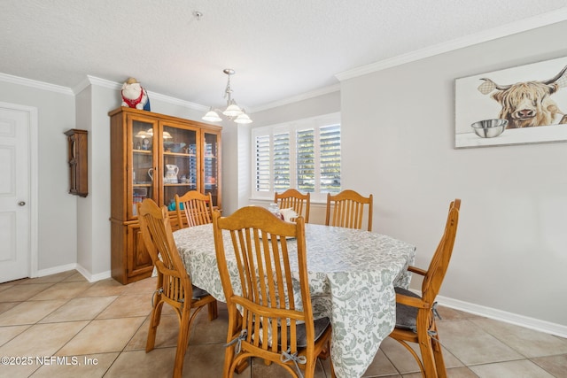 dining room featuring an inviting chandelier, light tile patterned floors, ornamental molding, and a textured ceiling