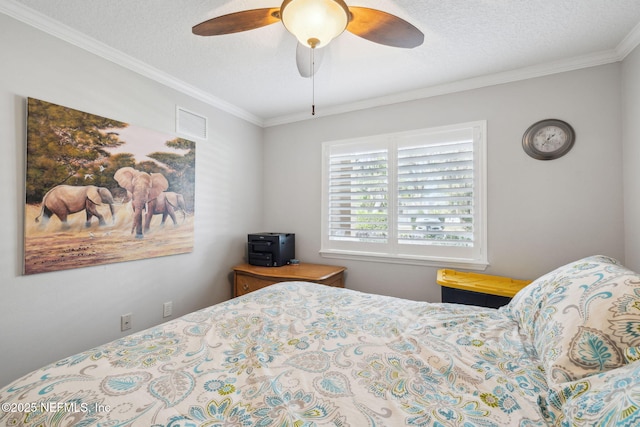 bedroom featuring crown molding, a textured ceiling, and ceiling fan