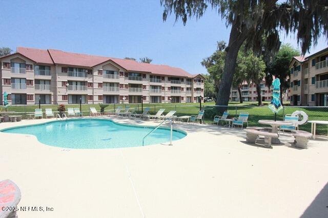 view of swimming pool with a patio