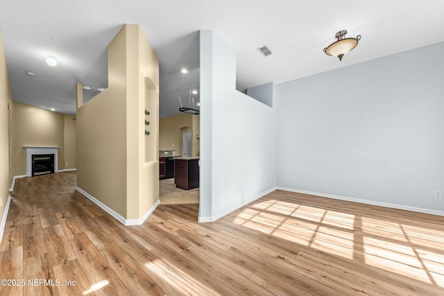 spare room featuring light hardwood / wood-style flooring