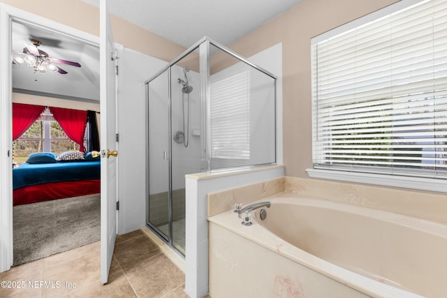 bathroom featuring shower with separate bathtub and tile patterned floors