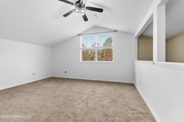 additional living space featuring ceiling fan, carpet floors, and vaulted ceiling