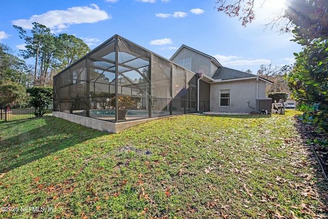 back of house featuring cooling unit, a fenced in pool, a yard, and glass enclosure