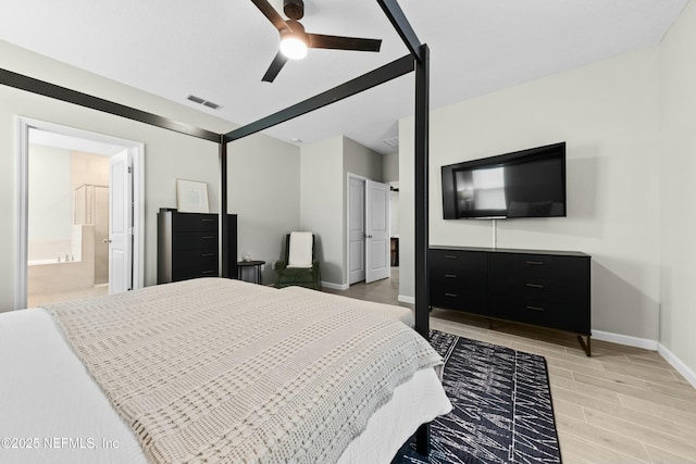 bedroom with ensuite bathroom and ceiling fan