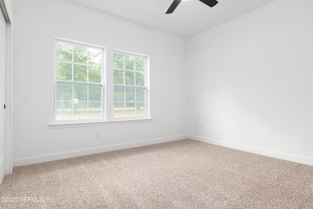 carpeted empty room with ceiling fan