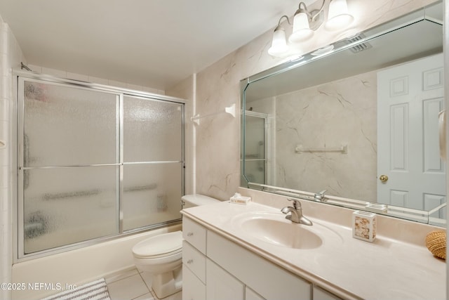 full bathroom with enclosed tub / shower combo, vanity, toilet, and tile patterned floors