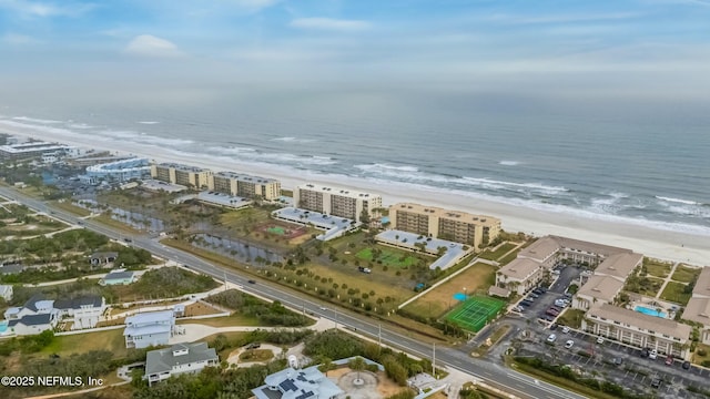 birds eye view of property featuring a water view and a view of the beach