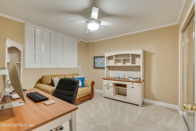 home office featuring crown molding, light carpet, a textured ceiling, and ceiling fan