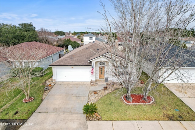 view of front of house with a garage and a front yard