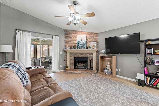 living room with a fireplace, vaulted ceiling, a textured ceiling, and light tile patterned floors