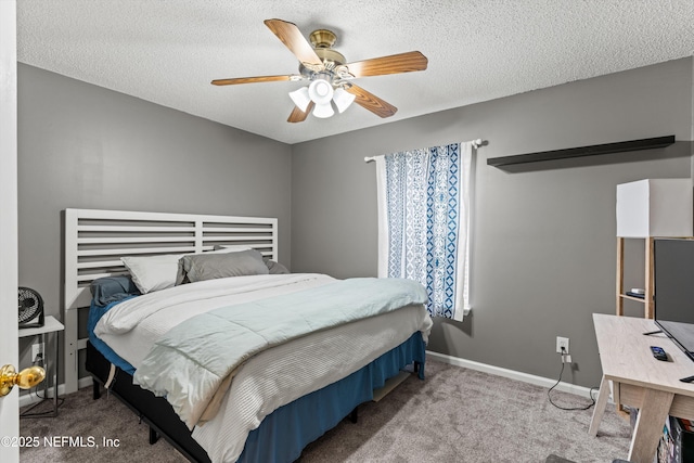 bedroom featuring a textured ceiling, carpet floors, and ceiling fan