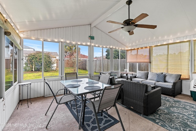 sunroom / solarium with vaulted ceiling, ceiling fan, and plenty of natural light