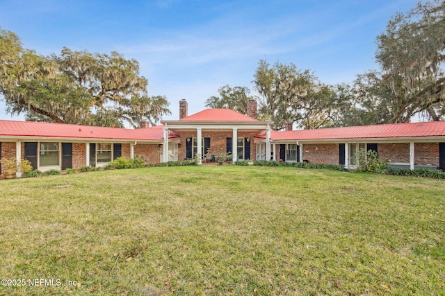 ranch-style home featuring a front yard