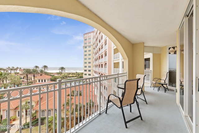 balcony featuring a water view