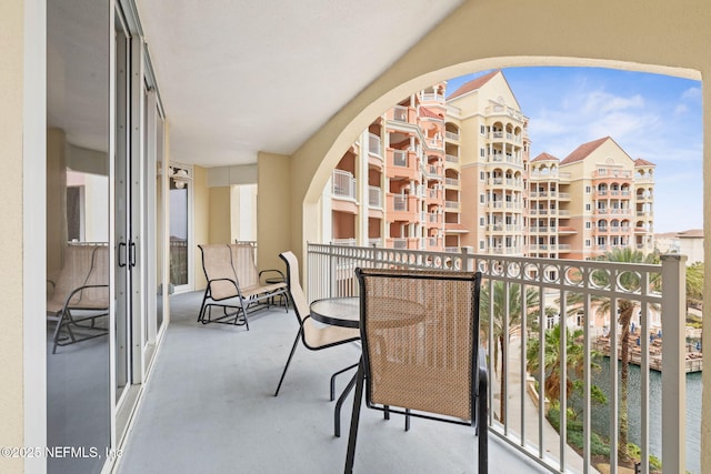 balcony featuring a water view