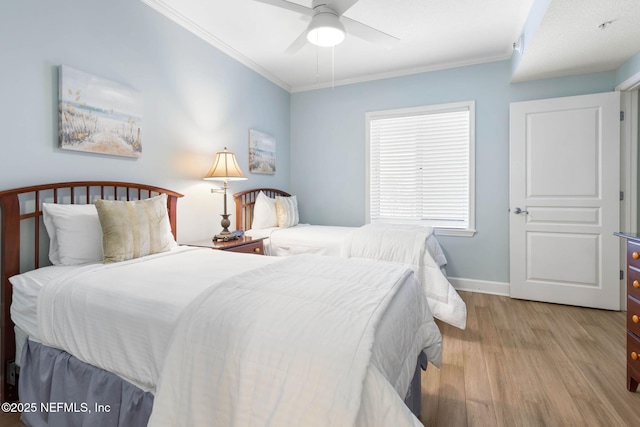 bedroom featuring ceiling fan, ornamental molding, and light wood-type flooring