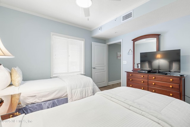 bedroom with hardwood / wood-style floors, crown molding, and ceiling fan