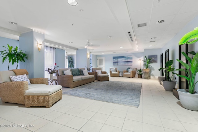 living room with ceiling fan and light tile patterned floors