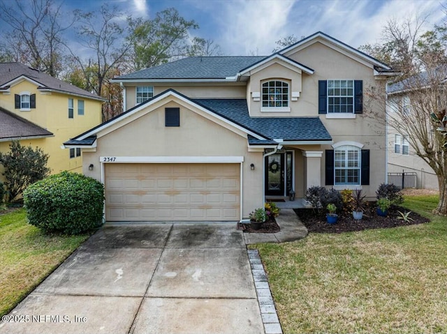 front facade with a garage and a front yard