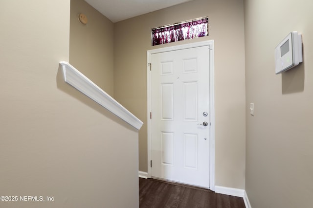 entryway with dark hardwood / wood-style floors