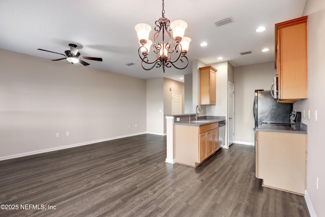 kitchen with light brown cabinetry, sink, appliances with stainless steel finishes, dark hardwood / wood-style floors, and pendant lighting