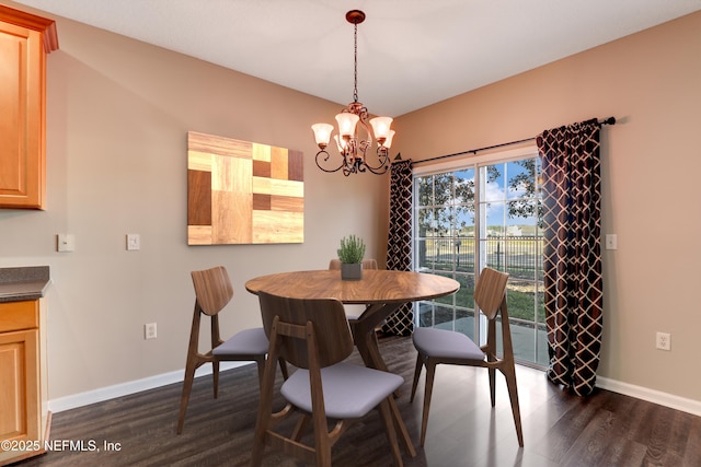 dining space featuring an inviting chandelier and dark hardwood / wood-style floors