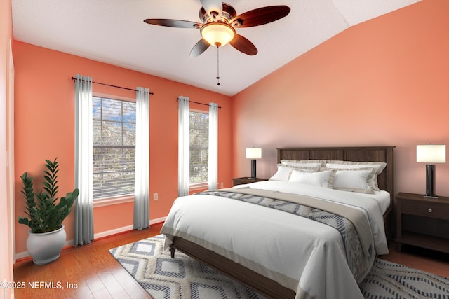 bedroom featuring vaulted ceiling, ceiling fan, and light hardwood / wood-style floors