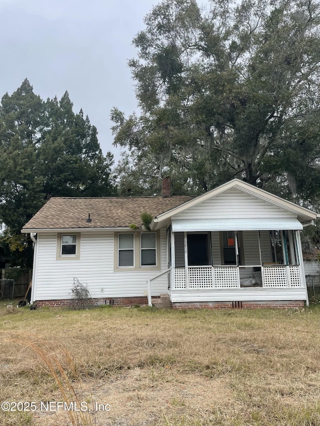 view of front of house with a front lawn and a porch