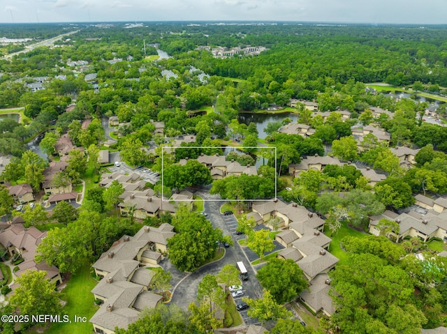 bird's eye view with a water view