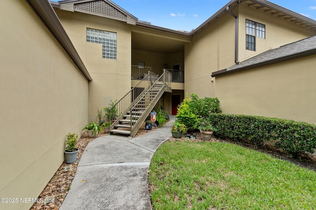 property entrance with a yard