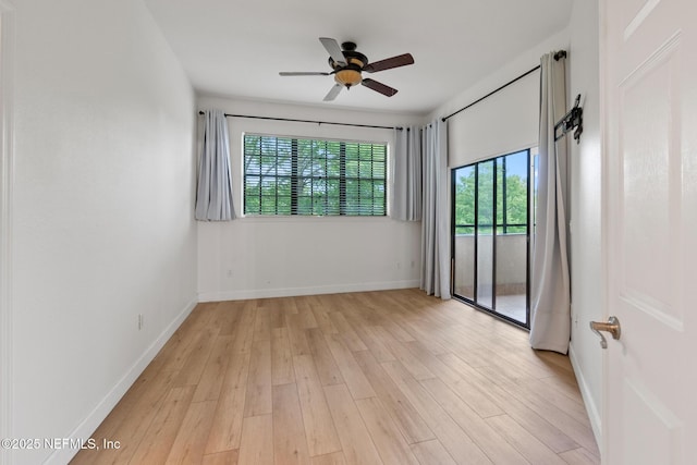 spare room featuring light hardwood / wood-style flooring and ceiling fan